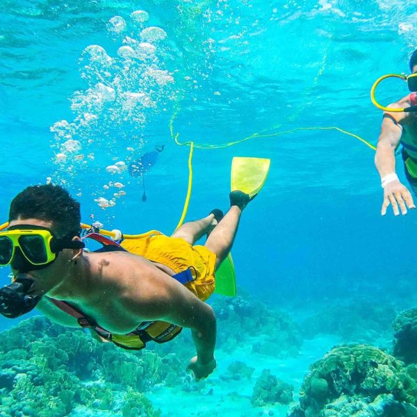 a man swimming in a pool of water