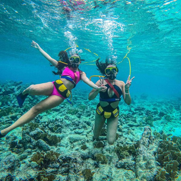 a person standing next to a body of water