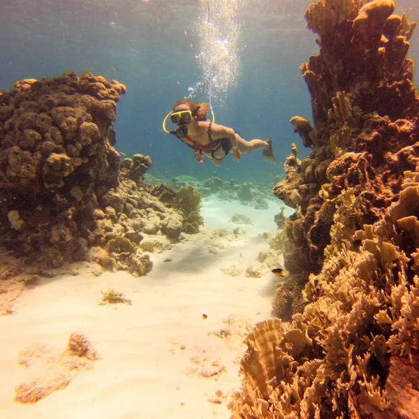 a man flying through the air while riding a bike down a dirt road